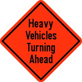 Construction heavy vechicles turning ahead sign