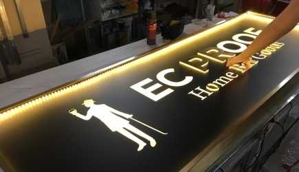 Bespoke brass lightbox with brass-faced 3D acrylic letters