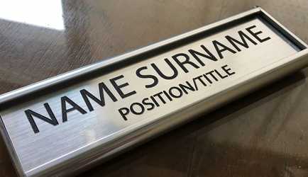 Framed silver office nameplate